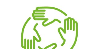Mehrere Hände, die im Kreis ineinander greifen
